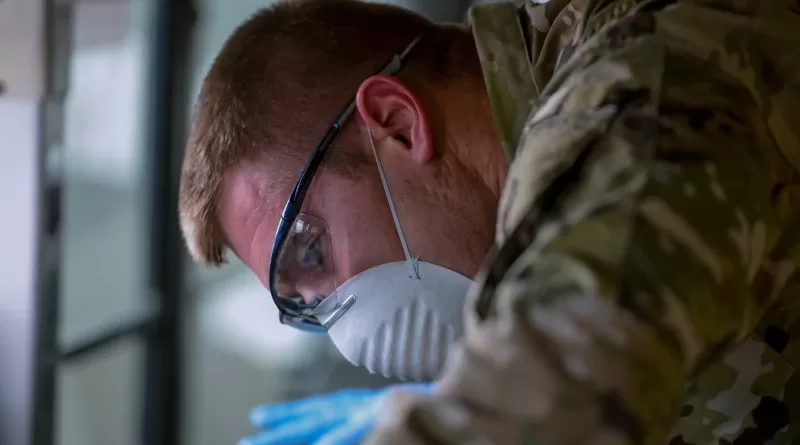 Air Force Staff Sgt. Colton Webber, 735th Air Mobility Squadron passenger terminal shift supervisor, decontaminates a bus after transporting passengers at Joint Base Pearl Harbor-Hickam, Hawaii, March 25, 2020. Photo Credit: Air Force Tech. Sgt. Anthony Nelson Jr.