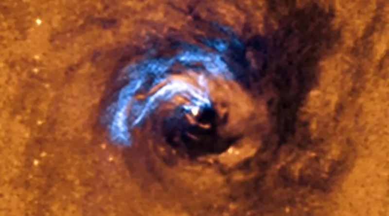 The image shows the process of nuclear feeding of a black hole in the galaxy NGC 1566, and how the dust filaments, which surround the active nucleus, are trapped and rotate in a spiral around the black hole until it swallows them. CREDIT: European Southern Observatory (ESO).