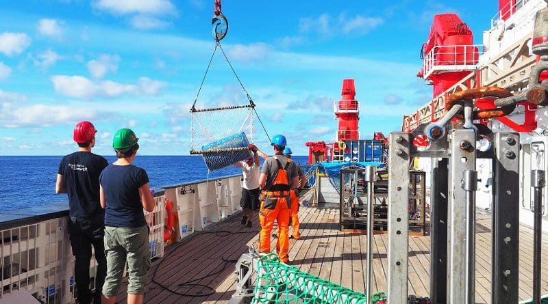 Catching a big blue barrel floating on the ocean surface in the Great Pacific Garbage Patch from the German research vessel SONNE during expedition SO268/3 crossing the North Pacific Ocean from Vancouver to Singapore in summer, 2019. ©Roman Kroke UFZ CREDIT ©Roman Kroke UFZ"