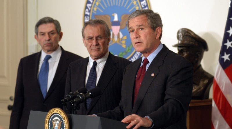 US President George W. Bush, Defense Secretary Rumsfeld, and Deputy Secretary Wolfowitz in March 2003. DoD photo by R.D. Ward, Wikipedia Commons