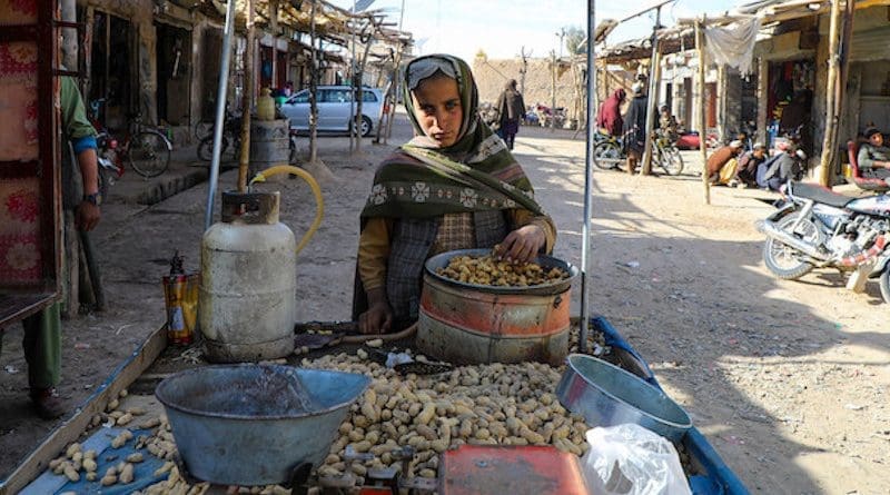 A young market vendor sells peanuts in Urozgan, a central province of Afghanistan. © UNICEF/Omid Fazel