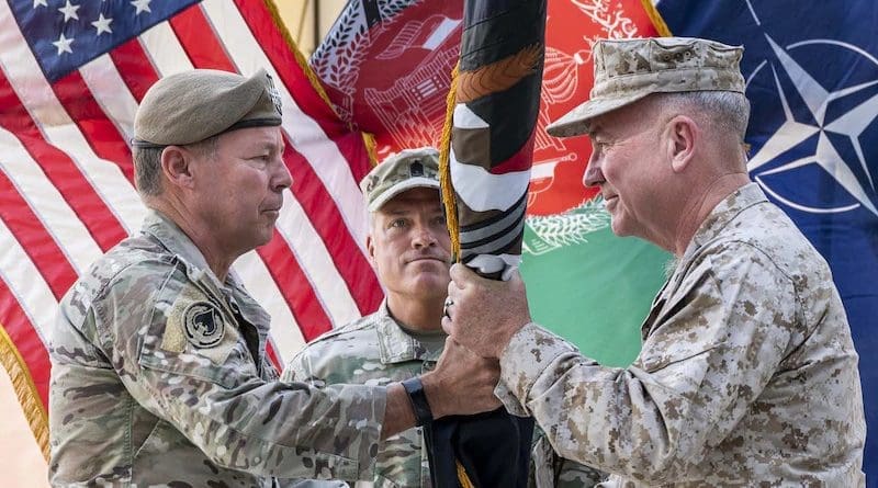 Army Gen. Austin S. Miller passes the flag of U.S. Forces Afghanistan to Marine Gen. Kenneth F. McKenzie during a ceremony in Kabul July 12, 2021. Photo Credit: DoD