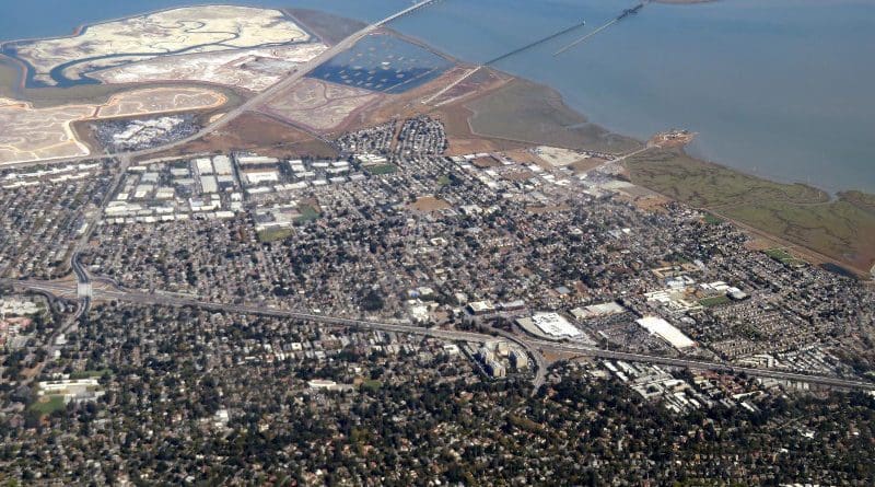 An aerial view of East Palo Alto, which borders San Francisco Bay. New research shows about half the households in East Palo Alto are at risk of financial instability from existing social factors or anticipated flooding through 2060. (Image credit: Wikimedia Commons)