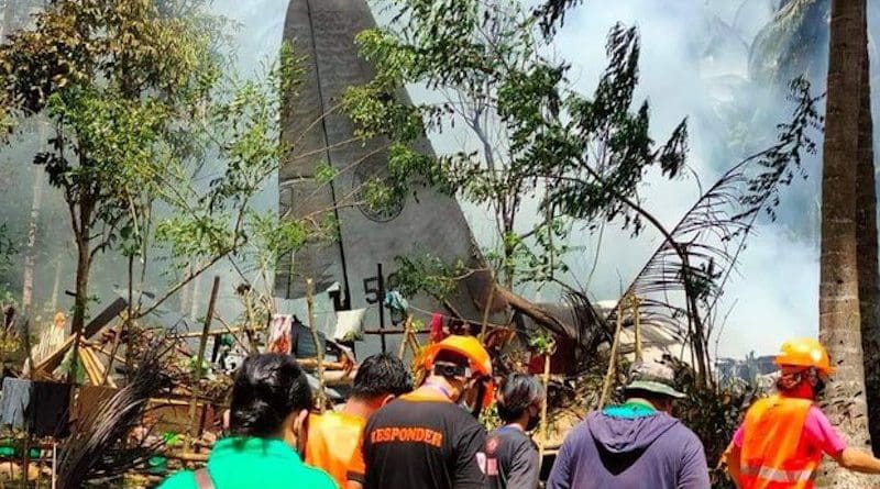 Rescuers search the site of a deadly C-130 plane crash in Patikul town, Sulu province, southern Philippines, July 4, 2021. Courtesy Joint Task Force Sulu