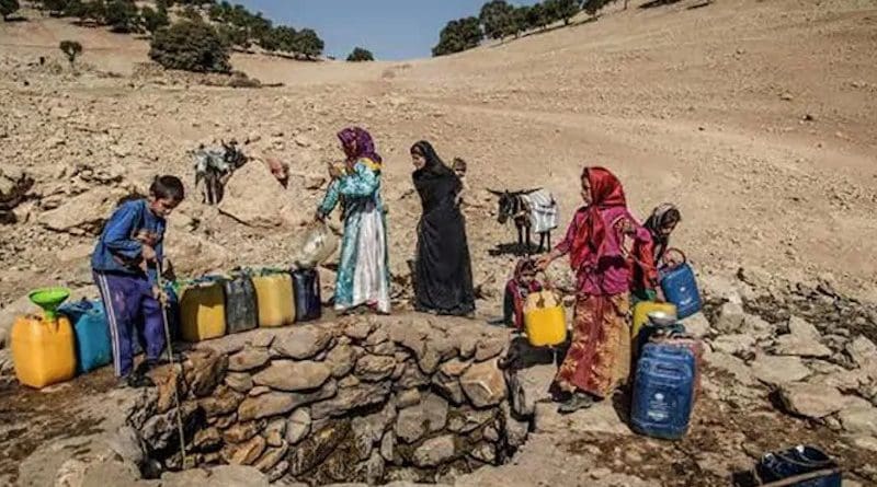 Iranians getting water from a well. Photo Credit: Iran News Wire
