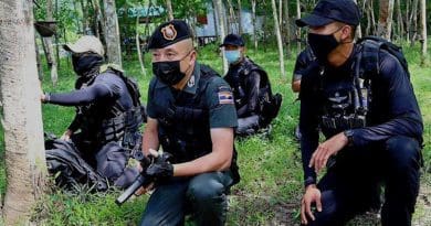 Police personnel search for suspected insurgents in Chamao Sam Ton village in Sai Buri, a district in Pattani province in Thailand, July 5, 2021. BenarNews