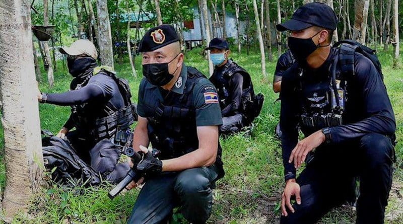 Police personnel search for suspected insurgents in Chamao Sam Ton village in Sai Buri, a district in Pattani province in Thailand, July 5, 2021. BenarNews
