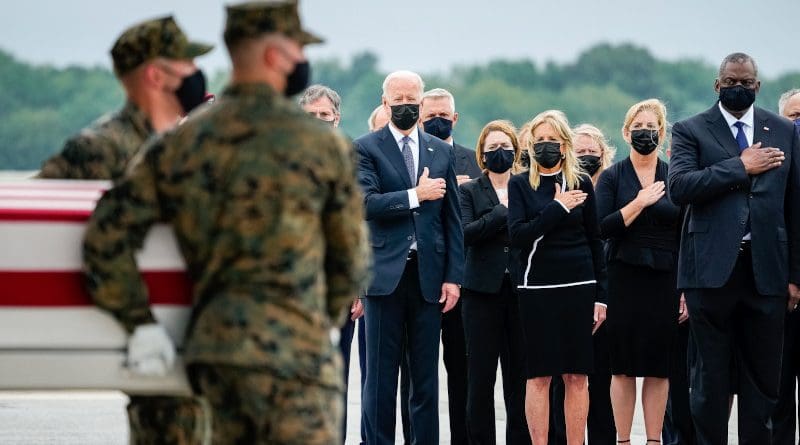 U.S. President Joe Biden and first lady Jill Biden during the transfer of the remains of US military service members who were killed by a suicide bombing at Kabul Airport, at Dover Air Force Base, Aug. 29, 2021. Photo Credit: The White House