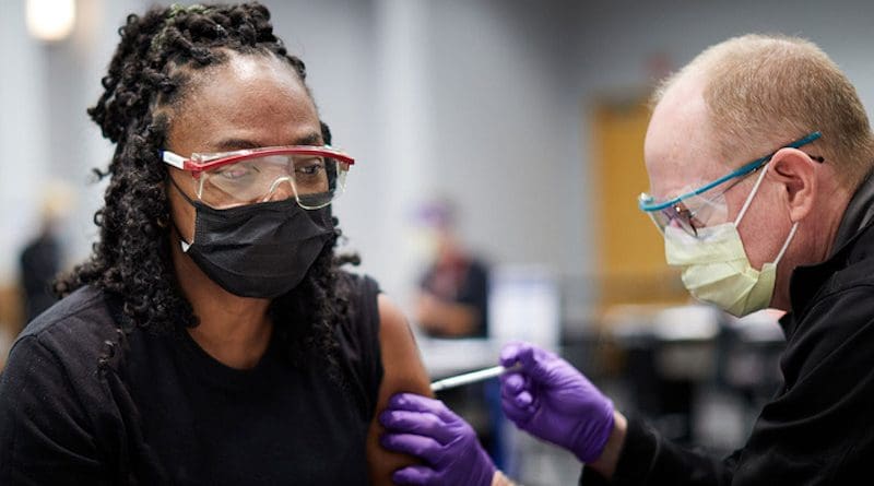 Cherry Grimmett, a BJC HealthCare security officer, receives her first dose of the Pfizer COVID-19 vaccine in December 2020. Researchers at Washington University School of Medicine in St. Louis have found that the delta variant of the virus that causes COVID-19 is largely unable to evade antibodies elicited by vaccination. The findings help explain why vaccinated people have been at low risk of getting seriously ill with COVID-19 despite a surge in cases caused by the delta variant. CREDIT: Matt Miller/Washington University
