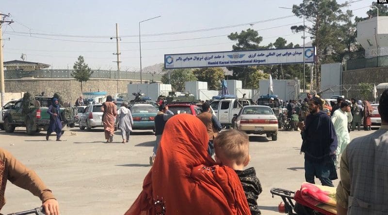 On the second day of the Taliban's rule in Kabul, the front of Hamid Karzai International Airport was crowded with people trying to travel abroad, but were stopped by Taliban militants. Photo Credit: VOA, Wikipedia Commons