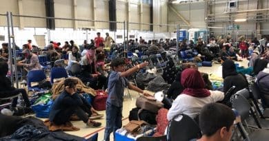 A departure lounge is set up in a C-5 hangar at Ramstein Air Base, Germany for Afghan refugees on their way to America, Sept. 10, 2021. Photo Credit: Jim Garamone, DOD