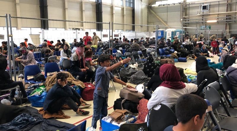 A departure lounge is set up in a C-5 hangar at Ramstein Air Base, Germany for Afghan refugees on their way to America, Sept. 10, 2021. Photo Credit: Jim Garamone, DOD
