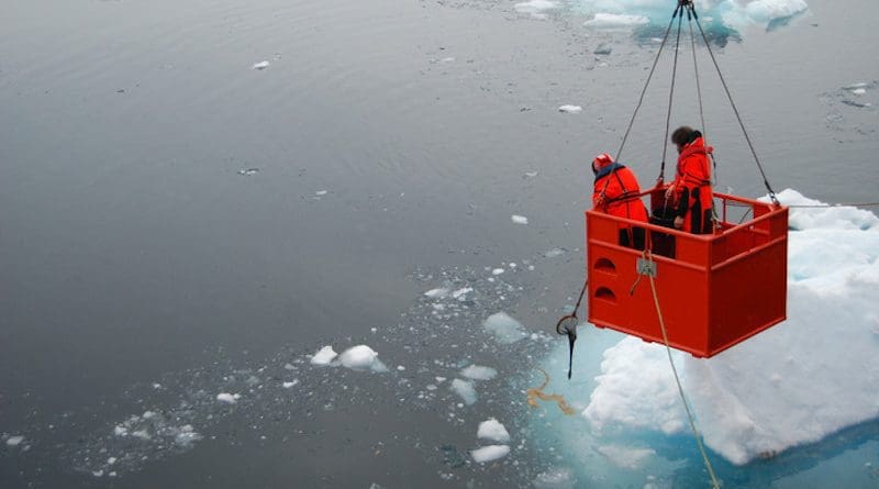 Scientists sample phytoplankton communities, utilising a ‘mummy chair.’ Shown here, they're sampling a brown mat of aggregated phytoplankton. This image complements work led by UEA researchers and published Sept. 16, 2021 in Nature Communications. CREDIT: Katrin Schmidt