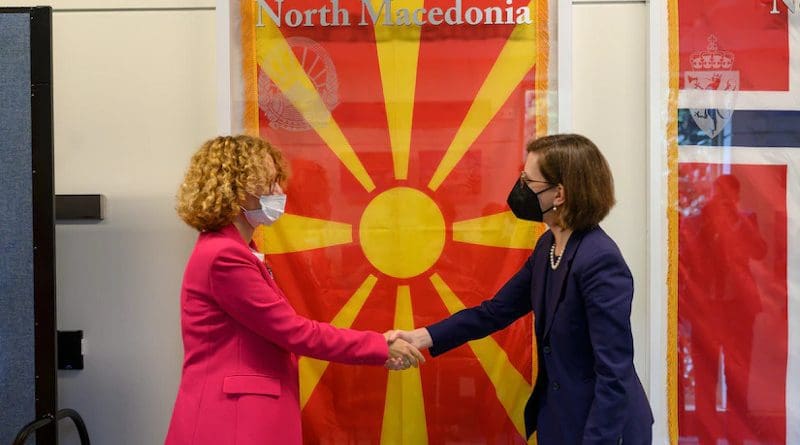 Performing the duties of assistant secretary of defense for international security affairs Laura Cooper and Republic of North Macedonia Minister of Defense Radmila Shekerinska share a congratulatory moment during the ceremony to unveil the flag of North Macedonia in the NATO Hallway at the Pentagon, Sept. 17, 2021. Photo Credit: Air Force Staff Sgt. Brittany A. Chase, DOD