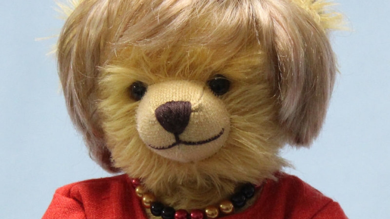 Close up of Hermann-Spielwaren teddy bear created in tribute to Germany's Angela Merkel. Photo Credit: © Facebook / HERMANN-Spielwaren GmbH