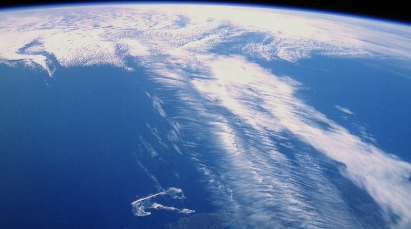 Clouds along a jet stream over Canada. Banded cirrus clouds running perpendicular to the jet stream—a telltale feature photographed by an astronaut aboard Space Shuttle Discovery. CREDIT: NASA