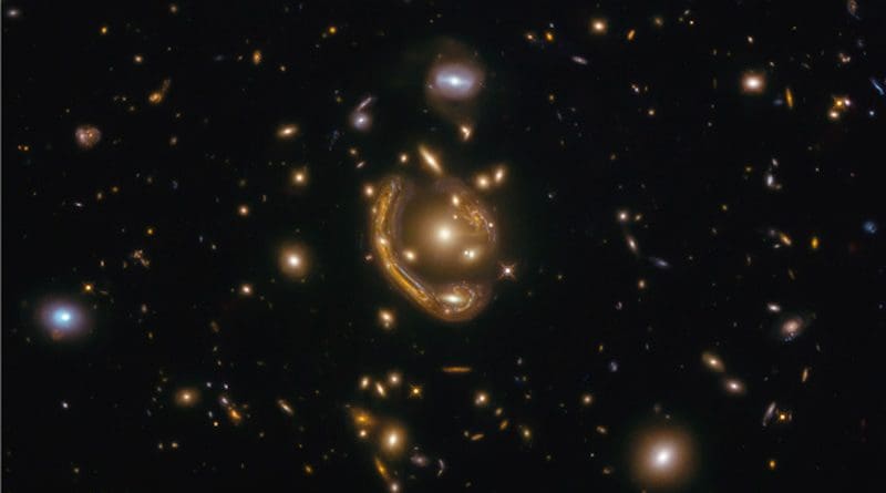 In this particular snapshot, a science discovery followed the release of a Hubble observation of a striking example of a deep-space optical phenomenon dubbed an "Einstein ring." The photo was released in December 2020 as an example of one of the largest, nearly complete Einstein rings ever seen. CREDIT: Saurabh Jha (Rutgers, The State University of New Jersey)
