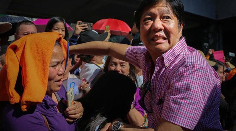 Former Philippine Sen. Ferdinand Marcos Jr. shakes hands with tourists during the Panagbenga Festival in the northern mountain resort city of Baguio, Feb. 24, 2018. Photo Credit: Jojo Riñoza/BenarNews