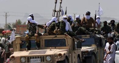 Taliban with a US military Humvee in Afghanistan. Photo via Social Media/Arab News