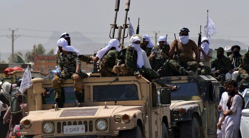 Taliban with a US military Humvee in Afghanistan. Photo via Social Media/Arab News