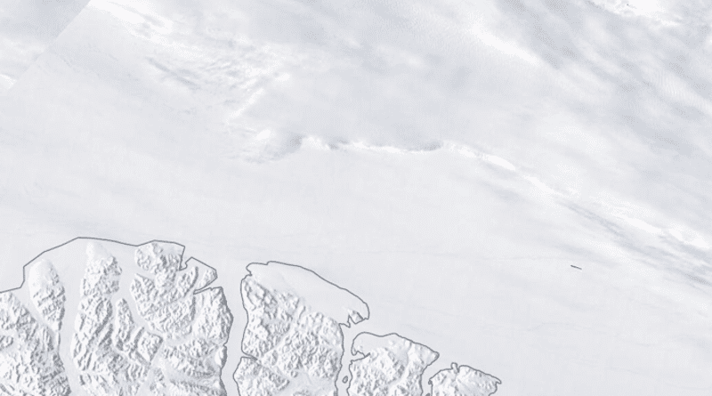 A polynya grows in the Last Ice Area above Canada’s Ellesmere Island. The gap in the ice was open for around two weeks in May 2020 due to strong, anticyclonic winds in the Arctic. CREDIT: NASA EOSDIS Worldview