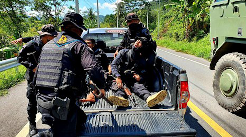 Soldiers load two comrades onto a pickup truck who were injured by a roadside bombing in Ngo-gabo, a village in Bannang Sata, a district of southern Thailand’s Yala province, Oct. 3, 2021. [BenarNews]