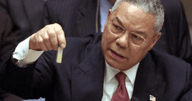 Colin Powell holding a model vial of anthrax while giving a presentation to the United Nations Security Council in February 2003. Photo Credit: United States Government, Wikipedia Commons