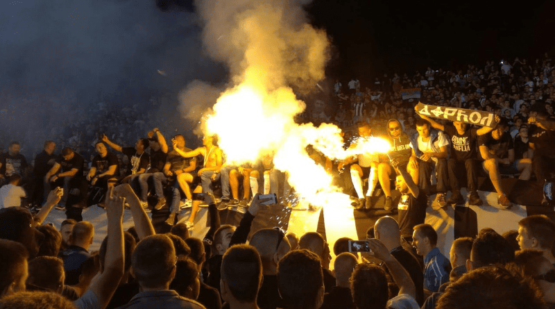 A row of Partizan supporters, including members of Belivuk’s group, celebrate their team’s victory on the south terrace of Partizan stadium in May 2017. Photo: BIRN