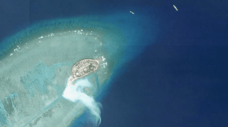 Satellite imagery shows work taking place on the southern tip Pearson Reef in the South China Sea on Friday. (Planet Labs)