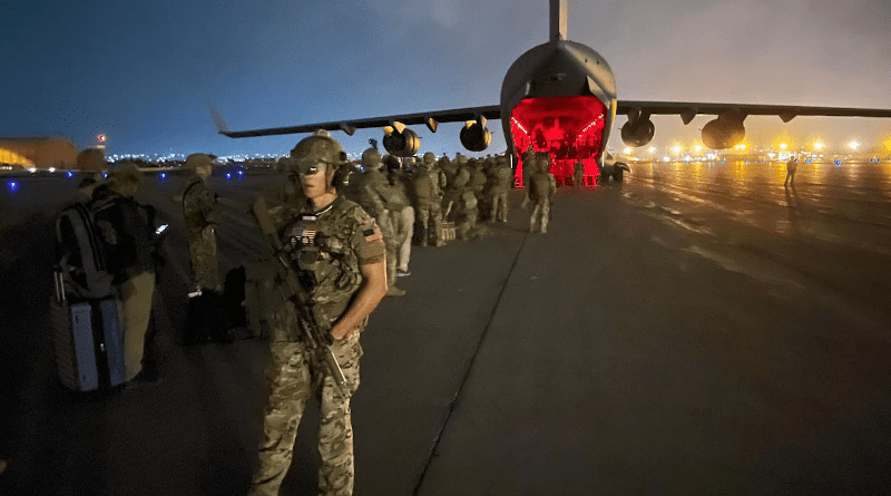 Army paratroopers assigned to the 82nd Airborne Division prepare to board an Air Force C-17 at Hamid Karzai International Airport in Kabul, Afghanistan, Aug. 30, 2021. Photo Credit: Army Master Sgt. Alexander Burnett
