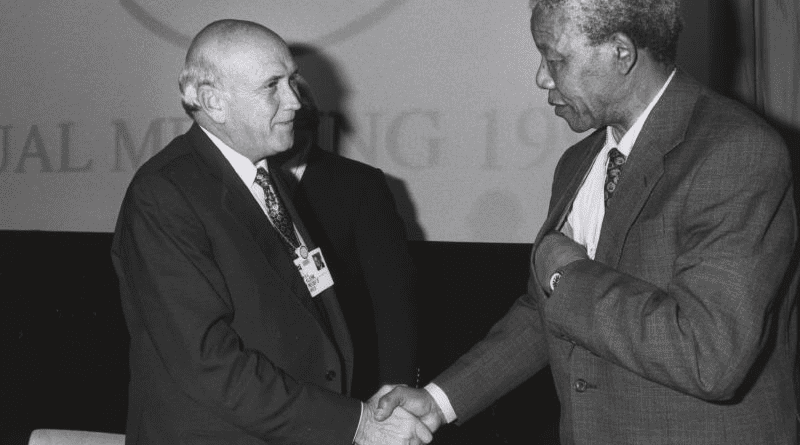 South Africa's President Frederik de Klerk and Nelson Mandela shake hands at the Annual Meeting of the World Economic Forum held in Davos, 1992. Photo Credit: World Economic Forum, Wikipedia Commons