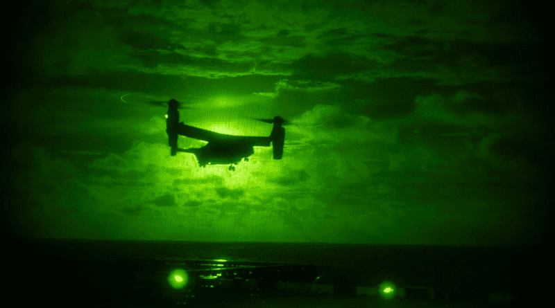 An MV-22B Osprey from the 31st Marine Expeditionary Unit prepares to land on the flight deck of the forward-deployed amphibious assault ship USS America during night flight operations in the East China Sea, June 26, 2021. Photo Credit: Navy Petty Officer 2nd Class Vincent E. Zline