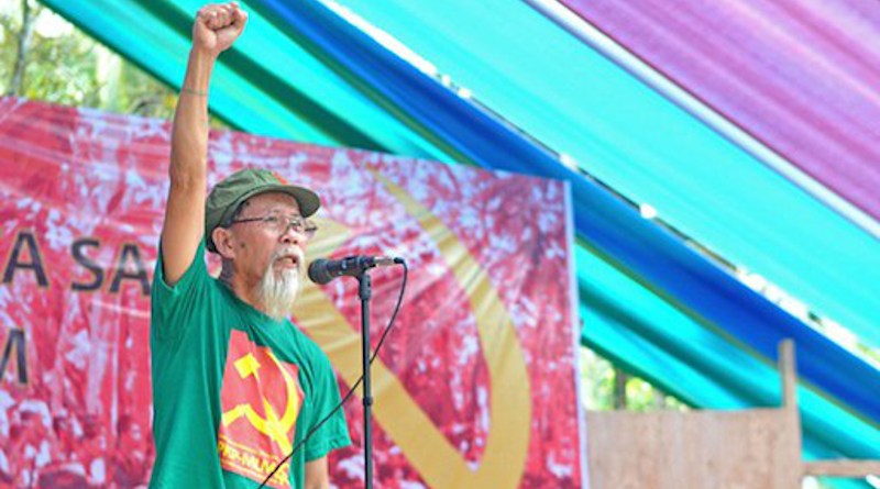 In this undated file photo, Jorge Madlos (also known as Ka Oris), a leader of the Philippine communist New People’s Army, raises a clenched fist at a rebel camp in Malaybalay, southern Philippines. [Froilan Gallardo/BenarNews]