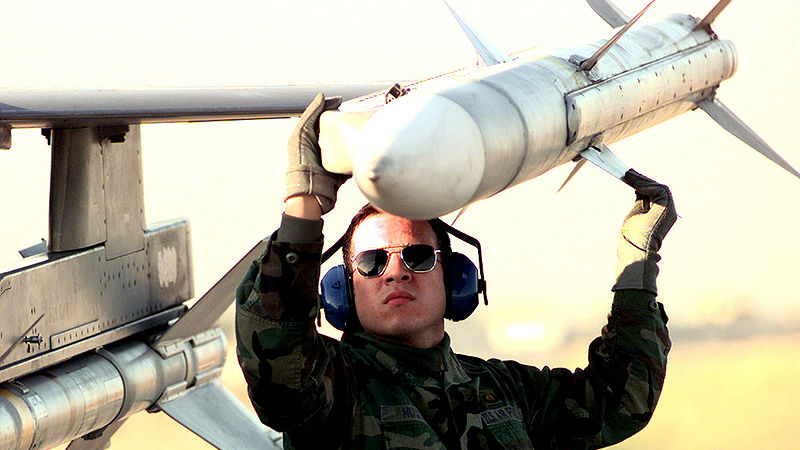 An AIM-120 AMRAAM being loaded onto an F-16CJ. Photo Credit: Staff Sergeant Vince Parker (USAF)