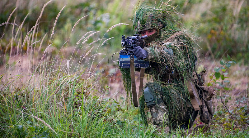 A Ukrainian soldier assaults a mock village during training at Rapid Trident 2021, Sept. 24, 2021, at the International Peacekeeping Security Centre near Yavoriv, Ukraine. Photo Credit: DOD