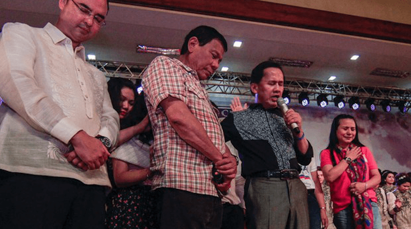 Pastor Apollo Quiboloy (second from right) prays with then-presidential hopeful Rodrigo Duterte at a birthday celebration during a thanksgiving worship service in Lingayen, a town in Pangasinan province, northern Philippines, March 27, 2016. Photo Credit: Jojo Riñoza/BenarNews