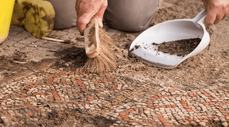 A member of the team from University of Leicester Archaeological Services during the excavations of a large mosaic in Rutland, UK. CREDIT: Historic England