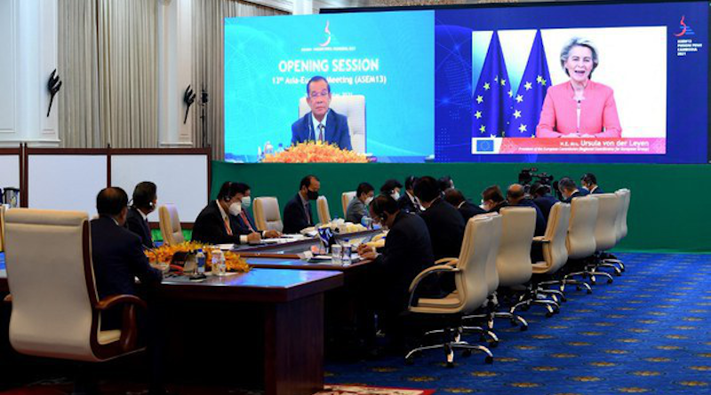 European Commission President Ursula von der Leyen (right on screen) speaks as Cambodia's Prime Minister Hun Sen (left on screen) and government officials listen at the Asia-Europe Meeting (ASEM) via video conference, in Phnom Penh, Nov. 25, 2021. [Handout National Television of Cambodia]