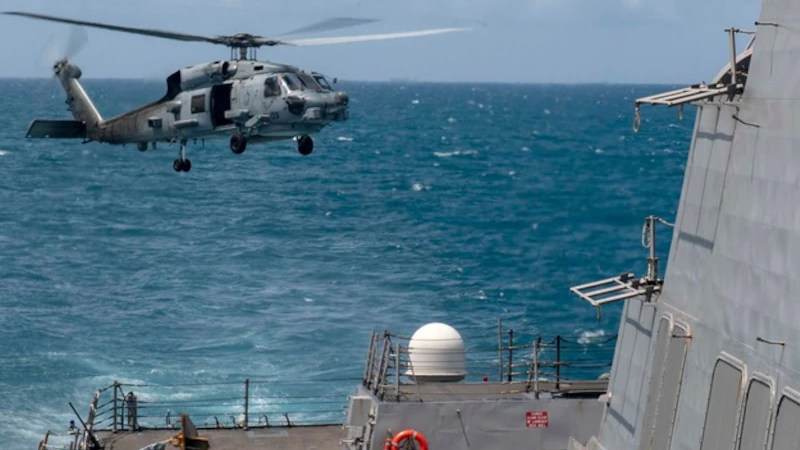 An MH-60R helicopter, assigned to Helicopter Maritime Strike Squadron 51, takes off from the flight deck of the Arleigh Burke-class guided-missile destroyer USS Mustin) as it conducts routine operations in the Taiwan Strait, Aug. 18, 2020. Mustin is forward-deployed to the U.S. 7th Fleet area of operations in support of security and stability in the Indo-Pacific region. Photo Credit: Navy Mass Communication Specialist 3rd Class Cody Beam