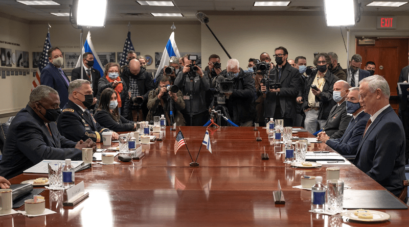 In a meeting room at the Pentagon, Dec. 9, 2021, defense representatives from the United States, including Secretary of Defense Lloyd J. Austin III (foreground, left), met with defense representatives from Israel, including Israeli Defense Minister Benjamin “Benny” Gantz (foreground, right). Members of the press gathered in the rear of the room at the opening of the meeting. Photo Credit: Lisa Ferdinando, DOD