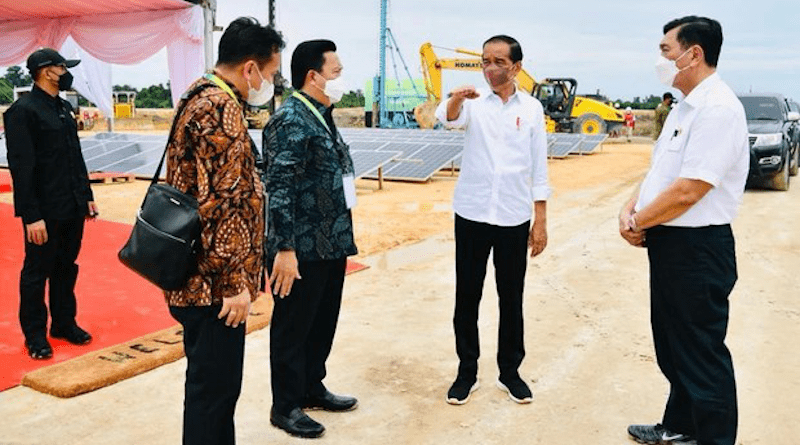 President Joko “Jokowi” Widodo talks to officials at the site of a project to construct a 30,000-hectare (116-square-mile) industrial estate in North Kalimantan, a province in the Indonesian section of Borneo Island, Dec. 21, 2021. Handout photo from the Cabinet Secretariat of the Republic of Indonesia