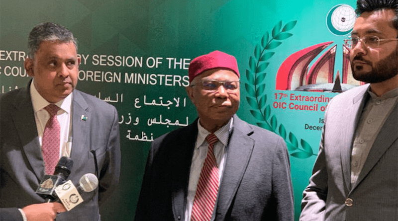 OIC Secretary-General Hissein Brahim Taha, center, arrives ahead of the 17th Extraordinary Session of Organization of Islamic Cooperation. (Twitter @oic_oci)