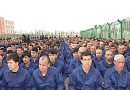 File photo of Uyghur detainees listening to speeches in a camp in Lop County, Xinjiang. Photo Credit: Wikipedia Commons