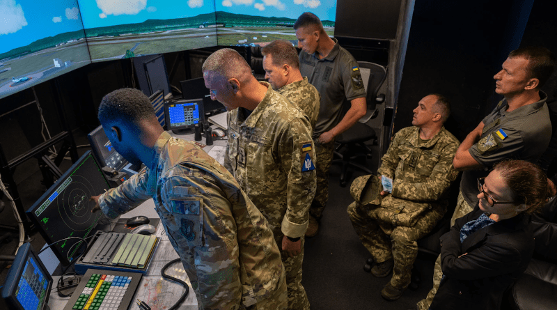 Air Force Staff Sergeant Jalah Patten, 86th Operations Support Squadron air traffic control tower watch supervisor, left, shows members of Ukrainian armed forces tower simulator system during their visit to Ramstein Air Base, Germany, August 5, 2021 (U.S. Air Force/John R. Wright)