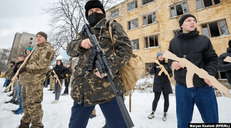 Several hundred people -- mostly men, many in camouflage or all-black clothing -- underwent civil-defense training on the grounds of an abandoned heavy machinery factory on Kyiv’s western outskirts. Credit: RFE/Rl