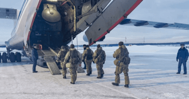 Russian servicemen board a military aircraft on their way to Kazakhstan, at an airfield outside Moscow on January 6. Photo Credit: Russia Defense Ministry