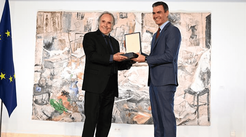 Joan Manuel Serrat (left) is awarded the Grand Cross of the Civil Order of Alfonso X the Wise by Spain's Prime Minister Pedro Sánchez. Photo Credit: Pool Moncloa / Borja Puig de la Bellacasa