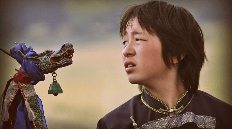 A Buryat boy in a shaman ritual in Russia. Photo Credit: Аркадий Зарубин, Wikipedia Commons