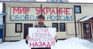 Activist Dmitry Skurikhin staged a single-person picket against the war with Ukraine in St. Petersburg on February 24. His sign reads: Stop, Fascist Bastard, Go Back. The sign in the back says: Peace To Ukraine, Freedom To Russia. (Photo Credit: RFE/RL)