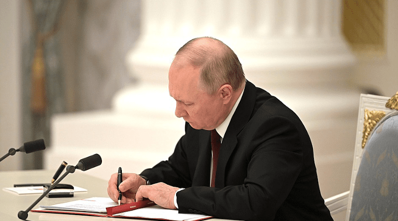 Russia's President Vladimir Putin signs documents recognizing Donetsk and Lugansk People’s Republics. Photo Credit: Kremlin.ru
